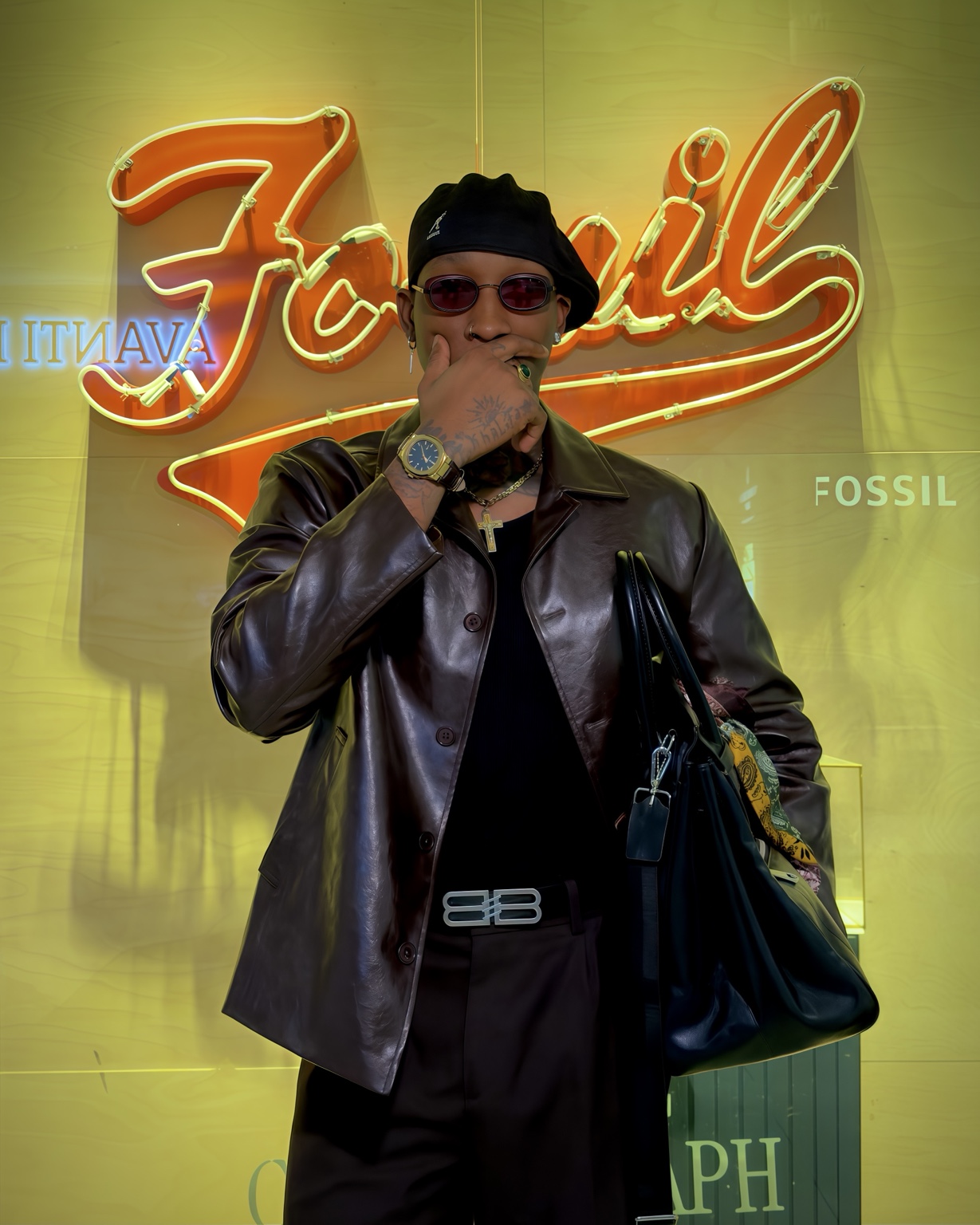 Claudio Conde wearing a brown leather jacket and gold watch